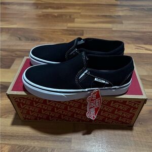 Vans Women’s Black and White Slip-On Sneakers